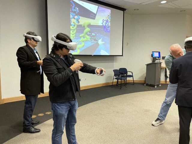 People wearing virtual reality headsets.